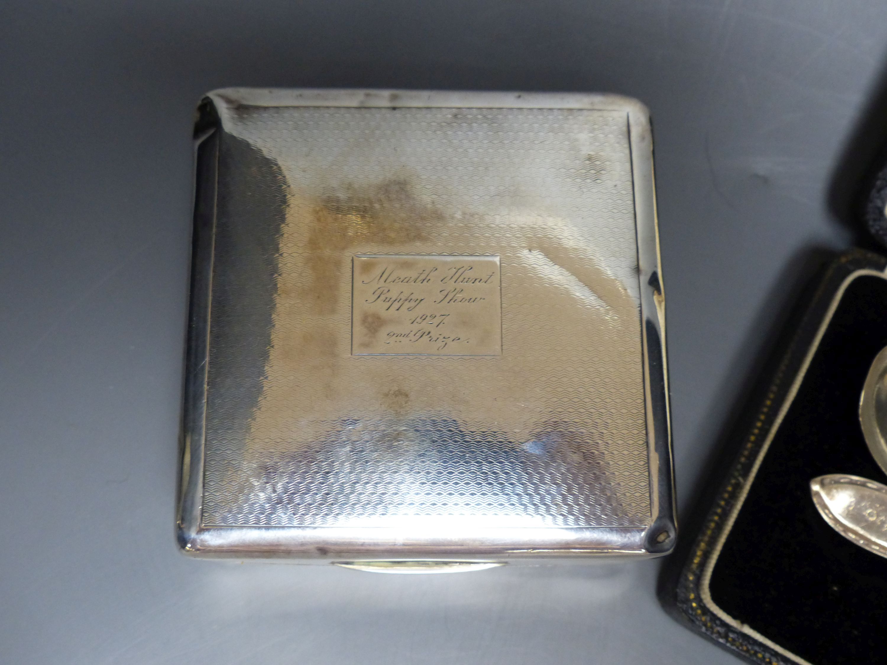 A sterling goblet, silver cigarette box, small beaker and cased spoon & pusher.